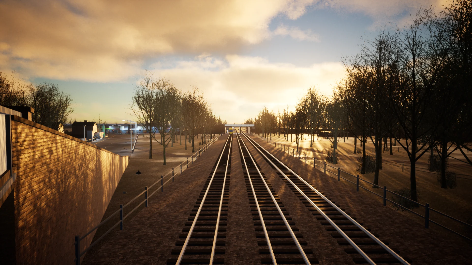 Railway tracks stretching towards the station under a golden sunset, viewed from Doncaster Road bridge